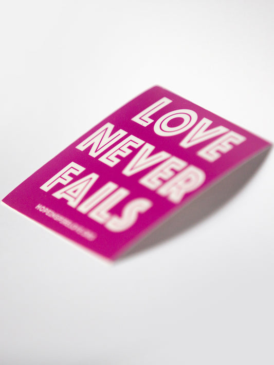 Love Never Fails Sticker - Magenta